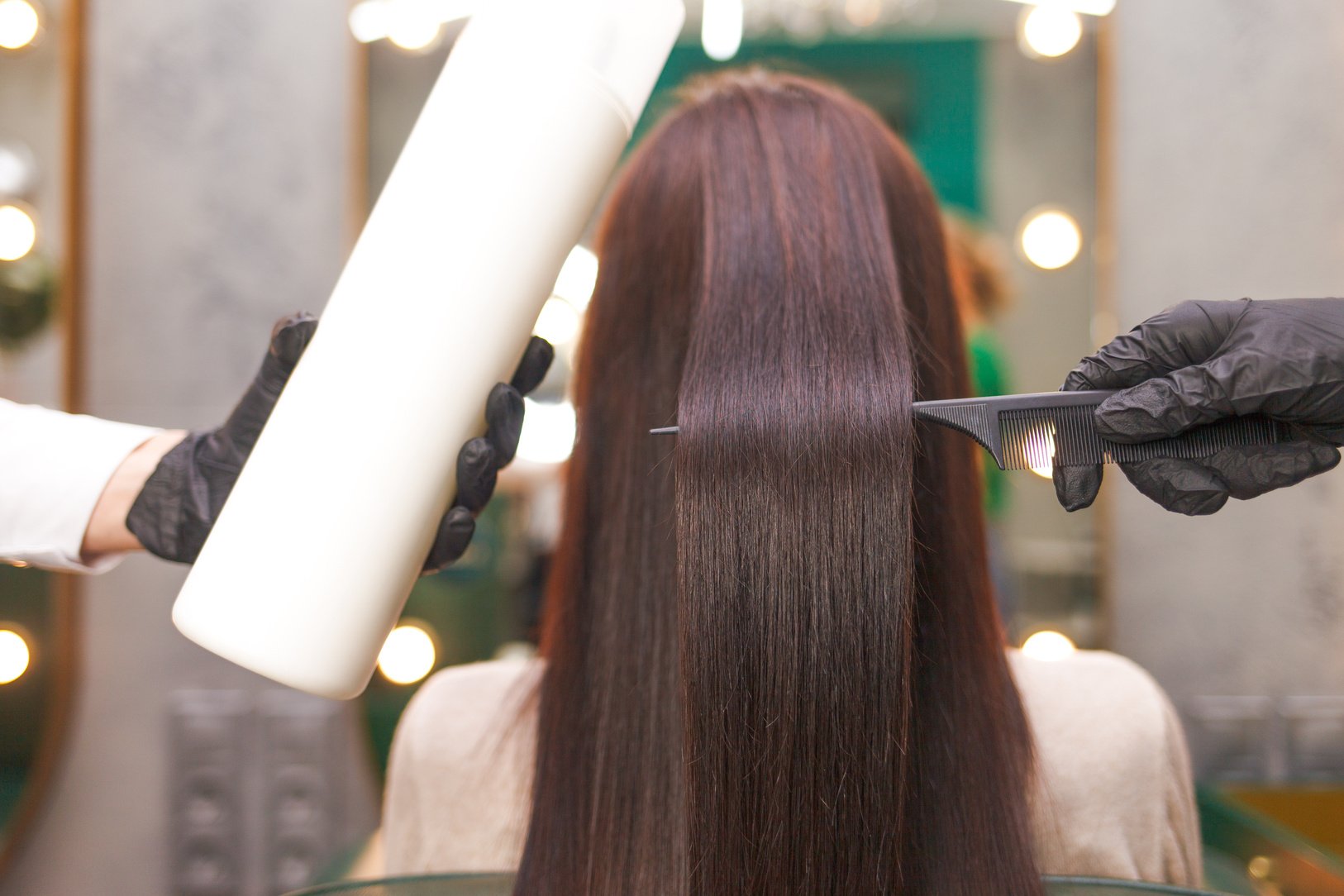 Back View of Woman Getting a Hair Treatment