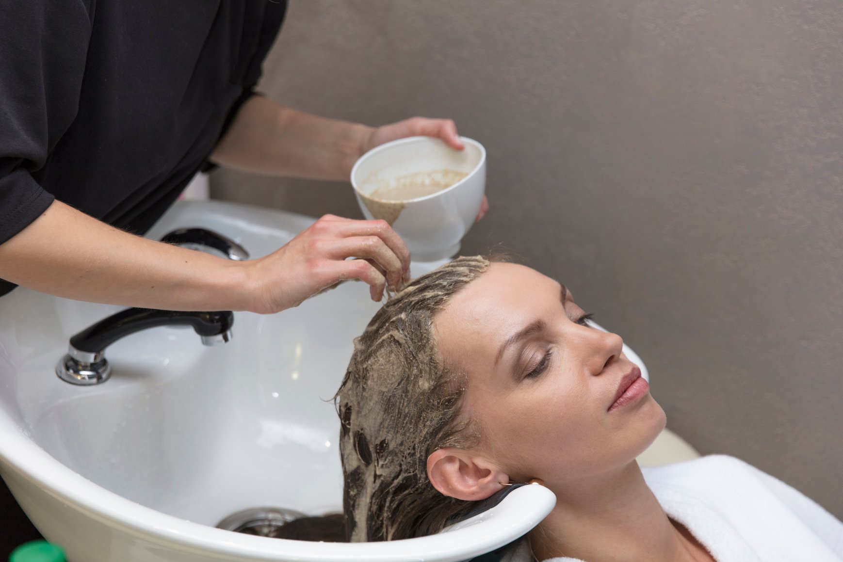 Woman Getting Hair Mask Treatment at the Salon