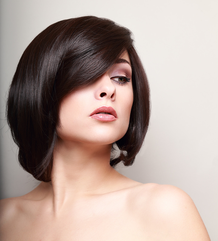 Sexy woman with short black hair. Hair style. Closeup